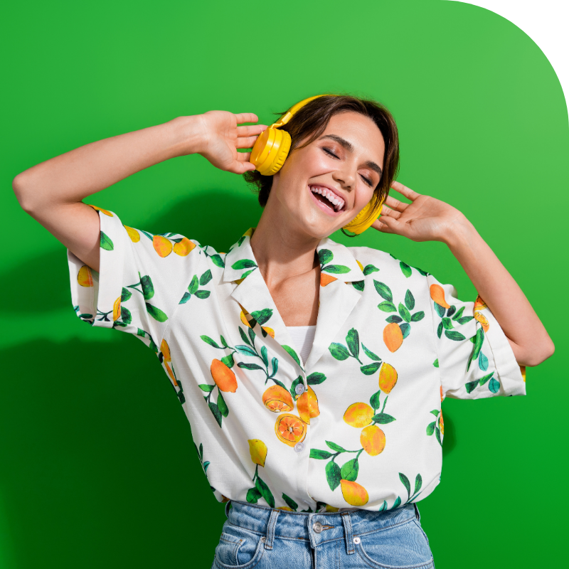 Portrait of a happy young woman listening to music