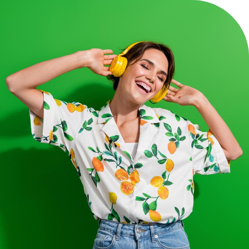 Portrait of a happy young woman listening to music