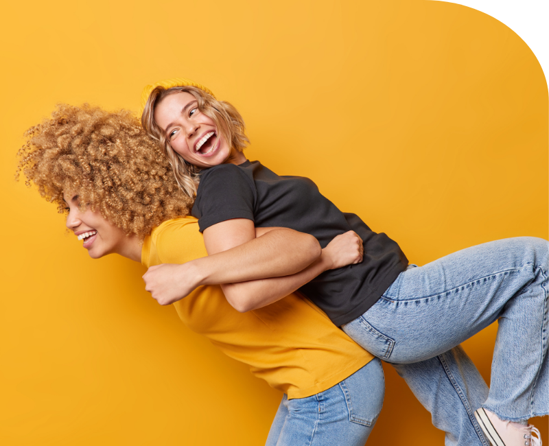 Portrait of two young and happy females